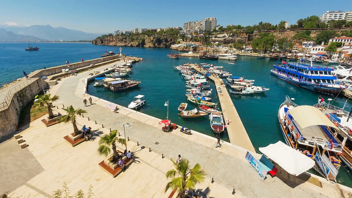 Kaleiçi's old harbour in Antalya, boats moored along the stone quay