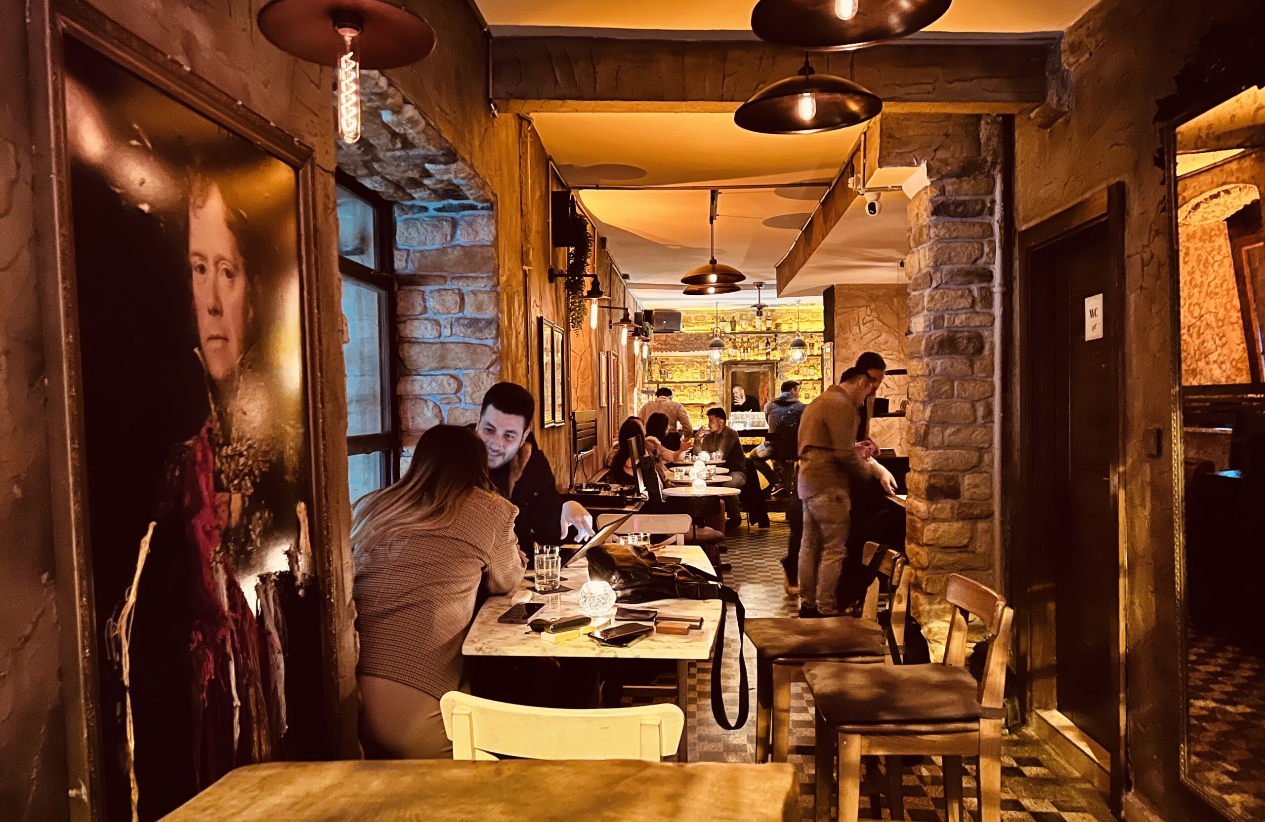 Flekk's intimate bar counter with house-made infusions on display