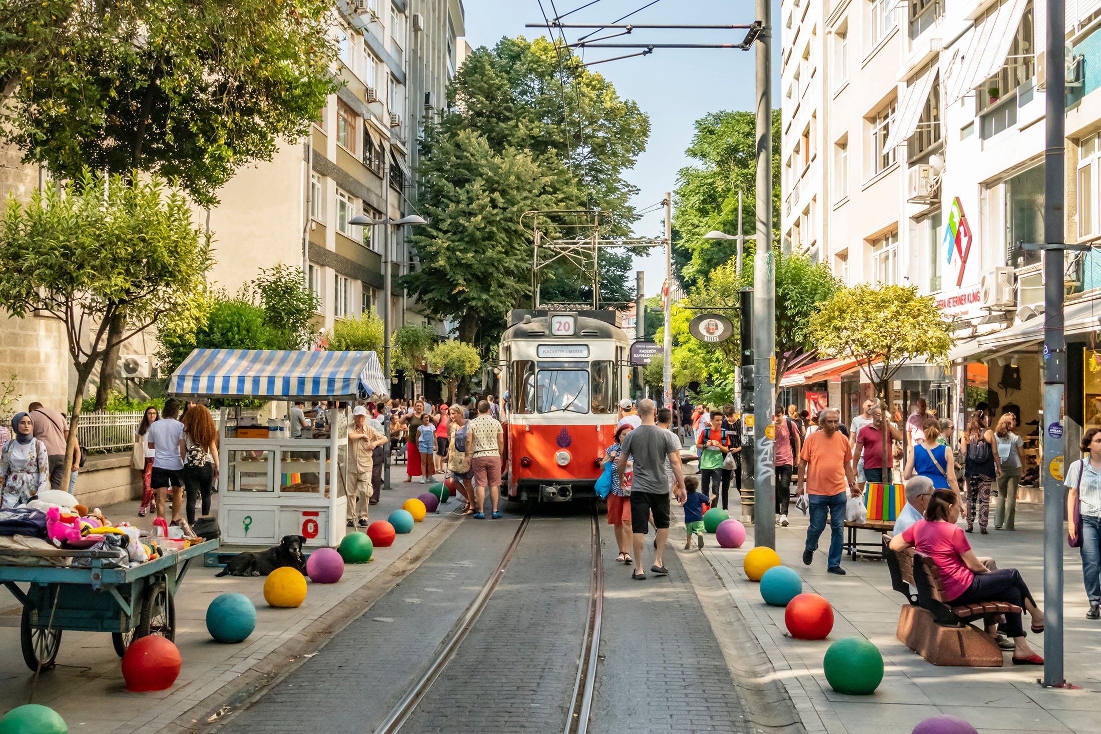 A Kadıköy street with the nostalgic Kadıköy-Moda tram and a mixed local crowd